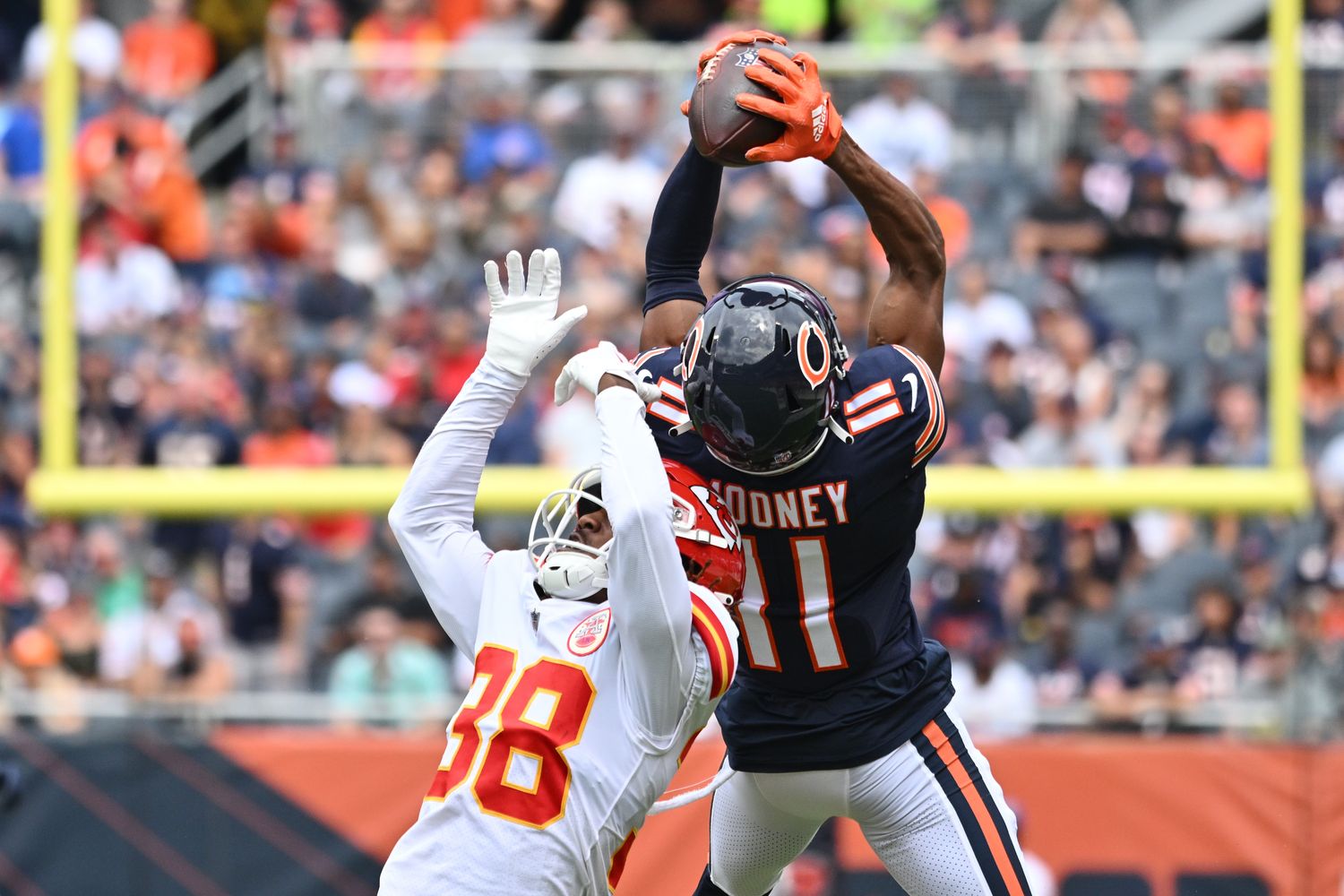 Aug 13, 2022; Chicago, Illinois, USA; Chicago Bears wide receiver Darnell Mooney (11) pulls in a 26-yard reception over Kansas City Chiefs cornerback L'Jarius Sneed (38) in the first quarter at Soldier Field. Mandatory Credit: Jamie Sabau-USA TODAY Sports  